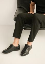 Black leather men's sports shoes BUTYM-0560-99(Z26) - side view of the product, on the model's feet, on a light background.