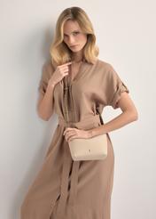 Small cream women's handbag TOREC-0882-0C(W26), product view on model's shoulder. Half of silhouette visible.