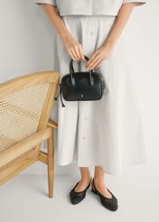 Black braided women's shoes BUTYD-1252-99(W26), front view of the product on the model's feet, on a light background.