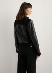 Women's black leather jacket KURDS-0587-99(W26), back view of the product on the model. Half of the silhouette visible.