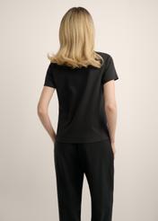 Women's black cotton t-shirt TSHDT-0144-99(Z25), back view of the product on the model. Half of the silhouette visible.