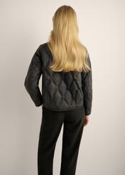 Black women's transitional jacket KURDT-0664-99(Z26). Rear view of the product on a model. Half of the silhouette is visible.