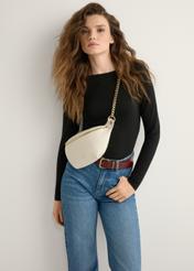 Women's cream waist bag TOREC-0788-0B(W26), front view of the product on the model. Half of the silhouette visible.