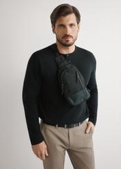 Black men's crossbody bag TORMN-0419-99(W26) - product view on model, against a light background. Knee-length silhouette visible.