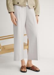 Women's camel leather slides BUTYD-1163-1D(W26), front view of the product on the model's feet.