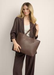 Women's brown shopper bag TOREC-0816-1H(Z26), front view of the product in the model's hand. Half of the silhouette visible.