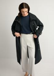 Women's black long coat KURDT-0653-99(W26), front view of the product on the model. Half of the silhouette visible.