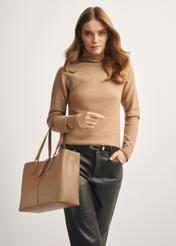 Beige women's handbag with monogram TOREC-0831A-81(Z25), front view of the product on the model, half of the silhouette visible.