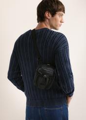 Men's city crossbody bag TORMN-0428-99(Z26), front view of the product on the model. Half of the silhouette visible.