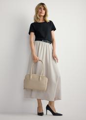 Beige women's shoulder bag TOREC-1232-1A(W26), product view in model's hand. Full body visible.