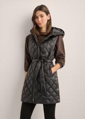 Women's black quilted vest KAMDT-0041-99(Z26), front view of the product on the model. Half of the silhouette visible.