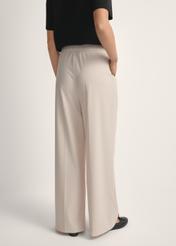 Light beige women's trousers SPODT-0119-1A(W26), back view of the product on the model. Half of the silhouette visible.
