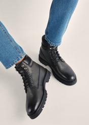Black men's leather ankle boots BUTYM-0504-99(Z25), product view on model's feet against a light background.