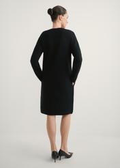 Black women's dress SUKDT-0260-99(W26), product view from the back, the model's entire silhouette is visible.