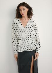 Women's cream polka dot blouse BLUDT-0204-0P(W26), front view of the product on the model. Half of the silhouette visible.