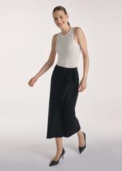 Black midi skirt SPCDT-0114-99(Z25), front product view on the model, full silhouette visible.