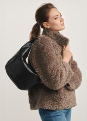 Black leather hobo bag TORES-1135A-99(Z25) - front view of the product on a model against a white background. Half of the silhouette visible from the side.