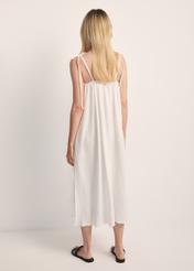 White strapless dress SUKDT-0250-11(W25) - product view from the back on the model. The entire silhouette is visible.