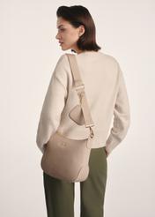 Beige women's hobo-style handbag TOREC-0829 A-80(Z 25), product view on model's shoulder. Half of silhouette visible.