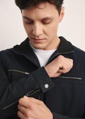 Men's navy blue transitional jacket KURMT-0384-69(Z25), product visible from the front on the model, close-up of the sleeve.