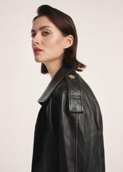 Brown oversize women's leather jacket KURDS-0553-2737(Z25), product visible diagonally on the model, half of the silhouette visible.