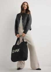 Black cotton bag TOREN-0136-9P(W26), product view in model's hand. Full body visible.