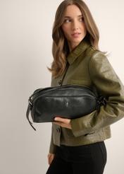 Black women's shoulder bag TOREC-1384-99(Z26), product view in model's hand. Half of silhouette visible.