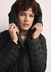 Long women's jacket with quilting KURDT-0523-98(Z25), close-up of this product on a model.