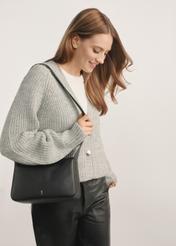 Women's black leather messenger bag TORES-1199-99(Z25) - front view of the product on a model against a white background. Half of the silhouette visible.