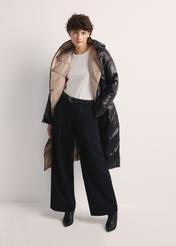 Long black women's winter jacket KURDT-0542A-98(Z25), product view from the front on the model, the whole silhouette is visible.