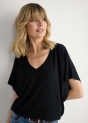 Black women's blouse BLUDT-0202-99(W26), close-up of the product from the front on the model's silhouette.