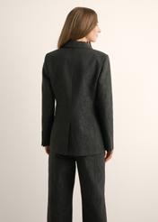 Women's black floral blazer ZAKDT-0052-99(Z26), back view of the product on the model. Half of the silhouette visible.