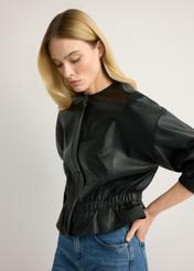 Women's black leather jacket KURDS-0570-99(W26), side view of the product on the model. Half of the silhouette visible.