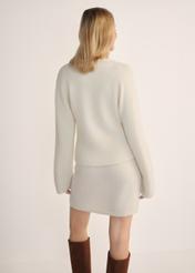 Women's cream wool cardigan KARDT-0059-12(Z25) - back view of the product on a model, against a white background. Knee-length silhouette visible.