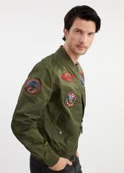 Olive men's TOP GUN KURMT-0381-57(W25) bomber jacket - side view on model on white background. Half of the silhouette visible.