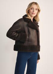 Women's brown leather sheepskin coat KOZDS-0096-3099(Z25) - side view, on a model, against a white background. Knee-length silhouette visible.