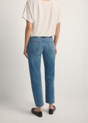 Women's dark blue denim jeans JEADT-0011-7C(W26), back view of the product on the model. Half of the silhouette visible.