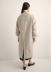 Long beige women's coat KURDT-0692-1J(Z26), product view from the back on the model, the whole silhouette is visible.