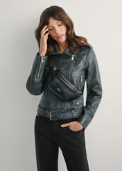 Women's black faux leather waist bag TOREC-1194-99(W26) - front view of the product, on a model, against a light background. Knee-length silhouette visible.