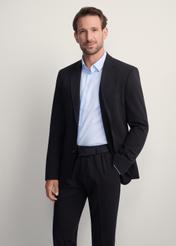 Black men's jacket MARMT-0019-99(Z25), front view of the product on the model, half of the silhouette visible.-02