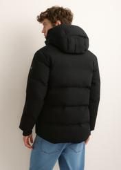 Men's black winter jacket KURMT-0447-99(Z26), rear view on a model. Half of the figure is visible.