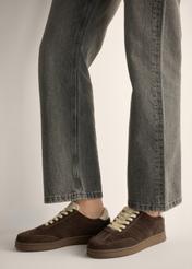 Dark brown suede sneakers BUTYD-1317-1I(Z26), side view of the product on a model. Half of the silhouette visible.