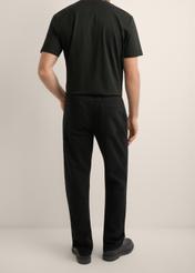 Men's black jeans JEAMT-0025-99(Z26), product view from the back on the model. Half of the silhouette visible.