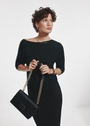 Black women's messenger bag TOREC-0984A-99(Z25) - view on a model on a white background. Half of the silhouette visible.