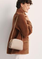 Small beige women's handbag TOREC-0036E-81(Z25), product view on model's shoulder. Half of silhouette visible.