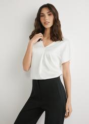 Cream women's blouse BLUDT-0206-0B(W26), front view of the product on the model. Half of the silhouette visible.