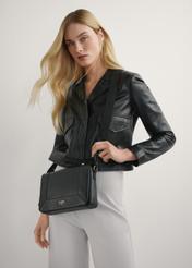 Black leather messenger bag TORES-1266-9I(W26) - front view of the product, on a model, on a light background.