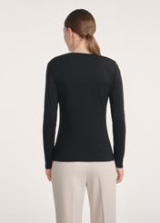 Black women's blouse LSLDT-0055-99(Z25), product visible from the back on the model, half of the silhouette visible.