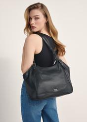 Large black leather women's handbag TORES-1042D-99(Z25) - front view of the product on a model against a white background. Half of the back is visible.