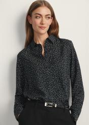 Women's black polka dot shirt KOSDT-0180-9P(W26), front view of the product on the model. Half of the silhouette visible.